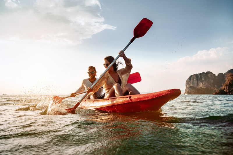 women sea kayaking