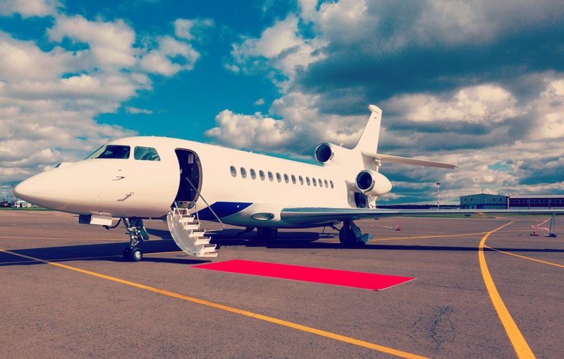 private jet with red carpet