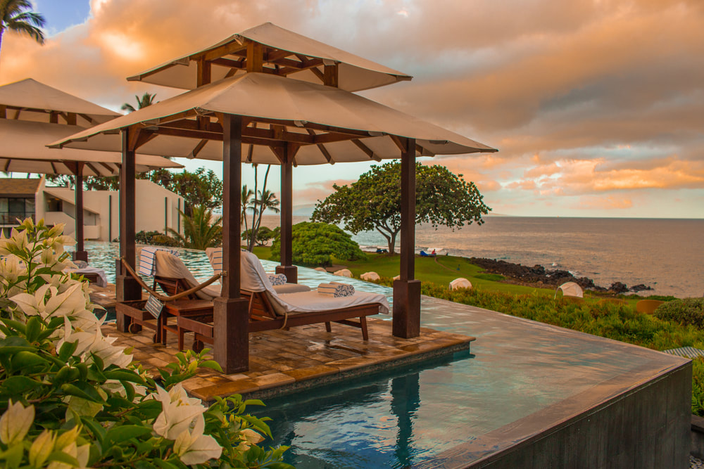luxury resort infinity pool with cabanas